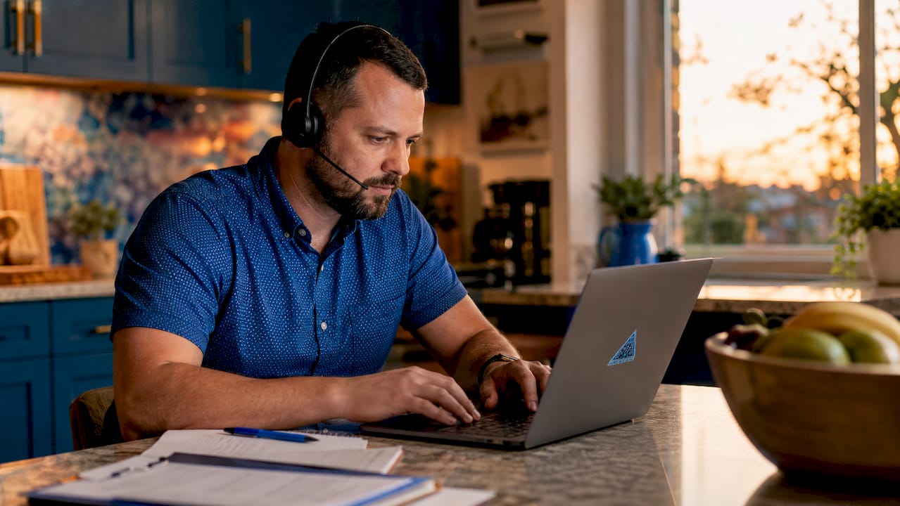 Dispatcher managing AI-assisted calls at desk