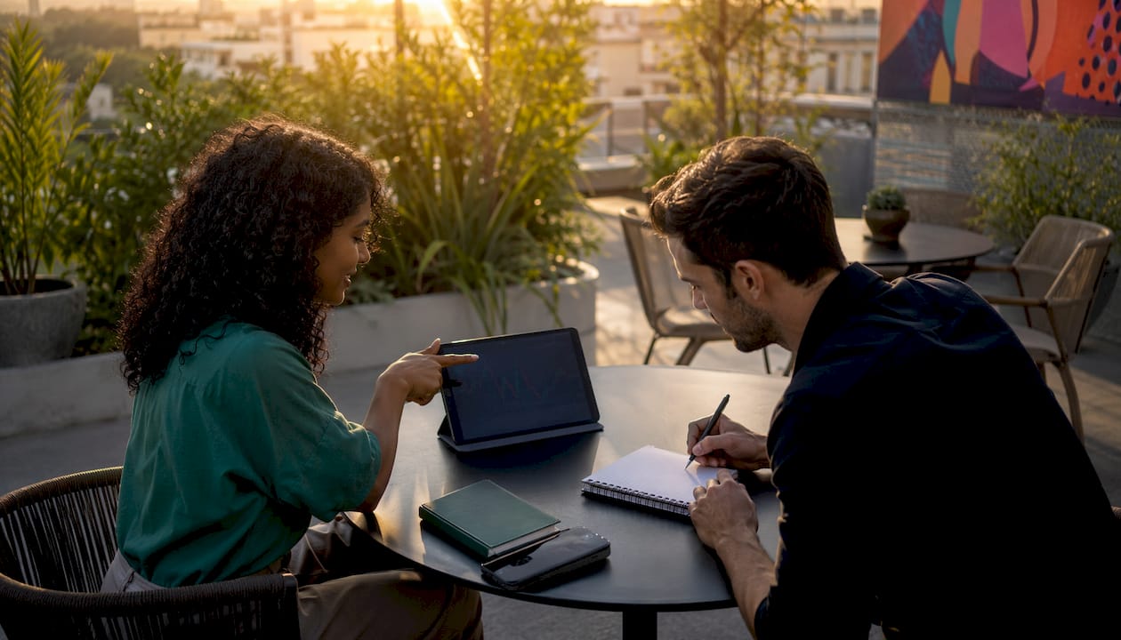 Two traders discussing options premium in meeting