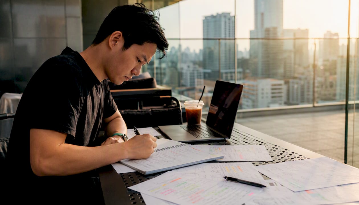 Trader working on options premium calculation notes