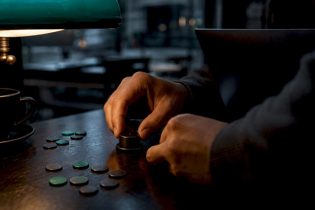 Hands adjusting option strategy dial before earnings