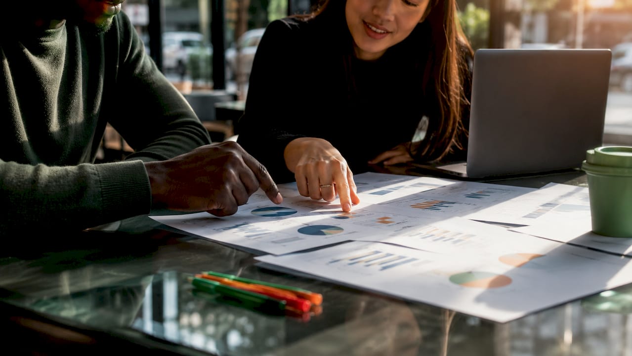 Collaborative hands reviewing affiliate analytics