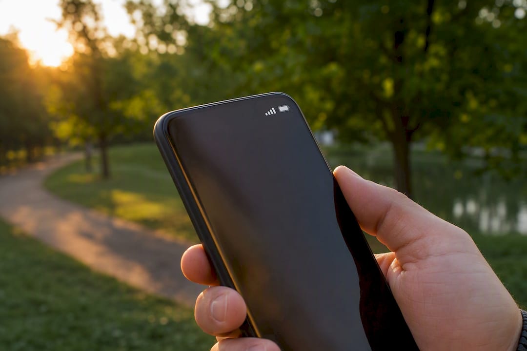 Hand holding phone with cellular connection