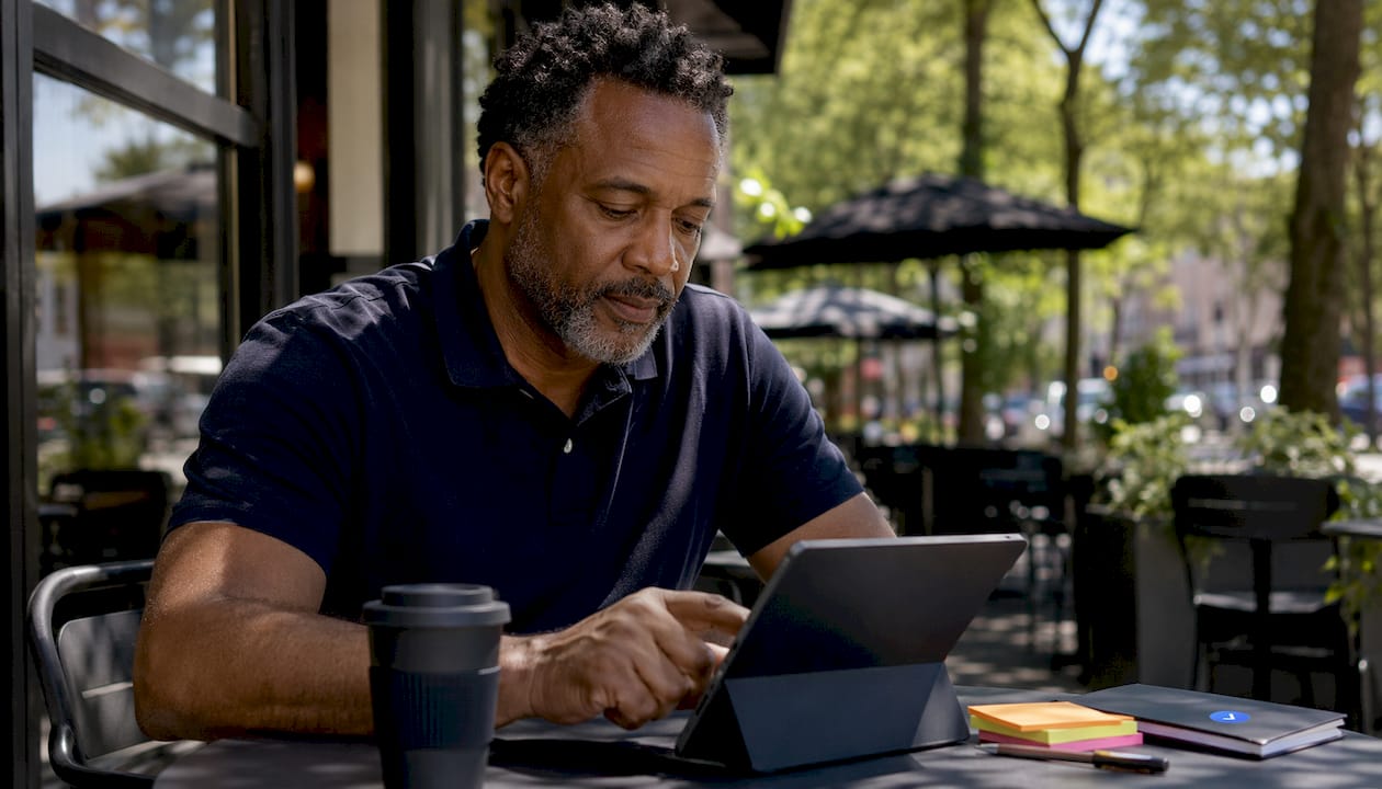 Man interacting with AI filtering on tablet