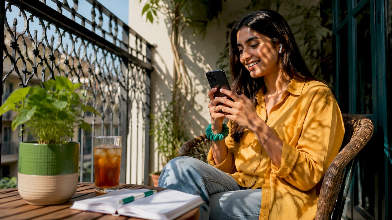Woman sharing deals on social media at home
