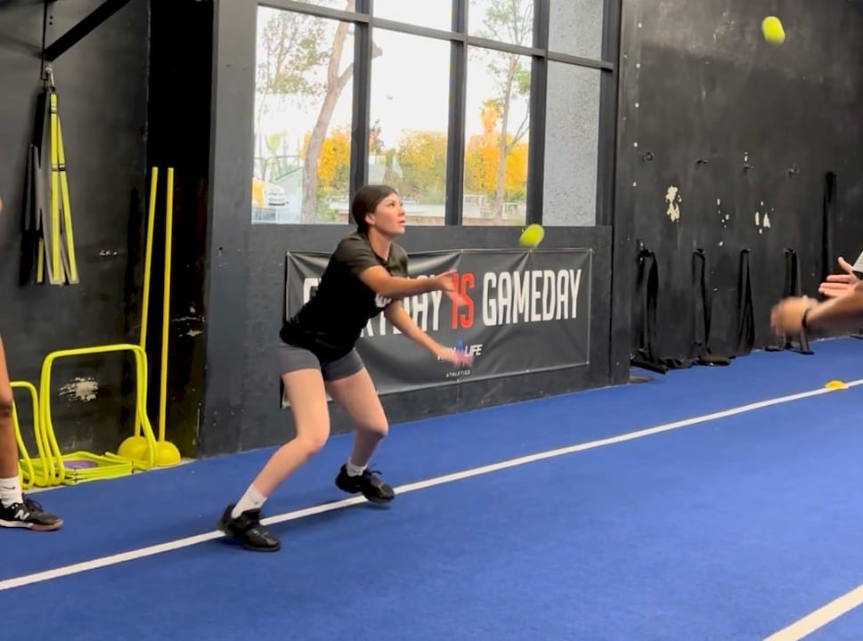 Youth athletes doing plyometric jumps in gym