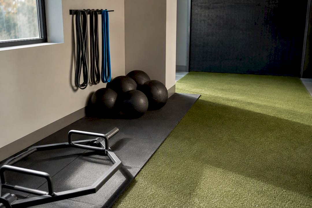 Baseball training tools arranged beside turf