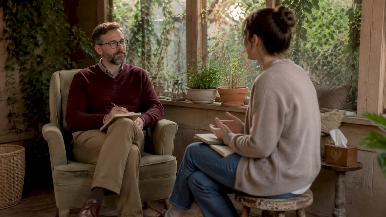 Therapist listening to client in office