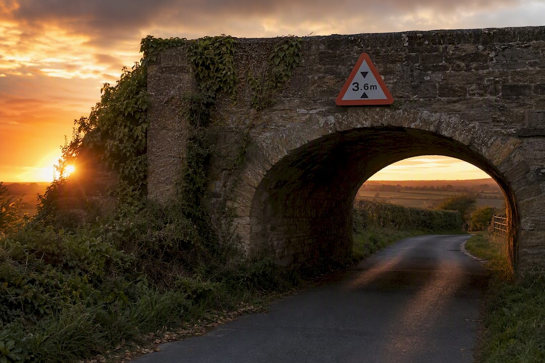 Low bridge clearance sign on UK road