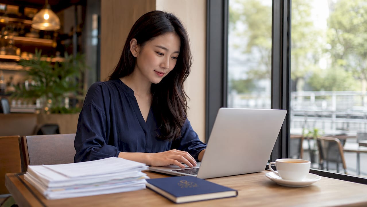 Hands typing on laptop for tax filing