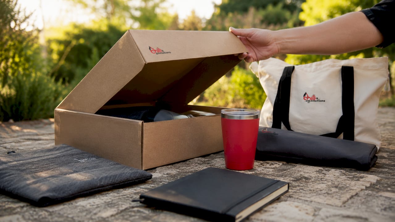 Branded merch box partially opened on wooden table