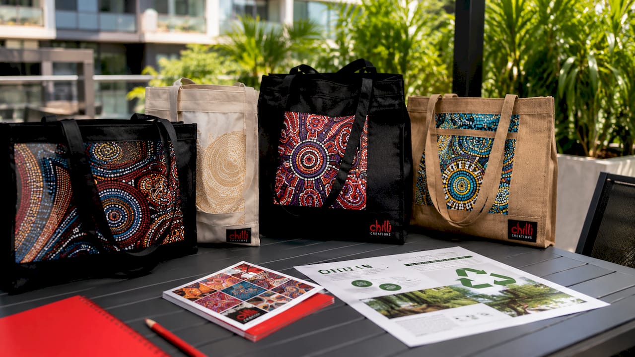 Eco tote bags and sample cards on meeting table
