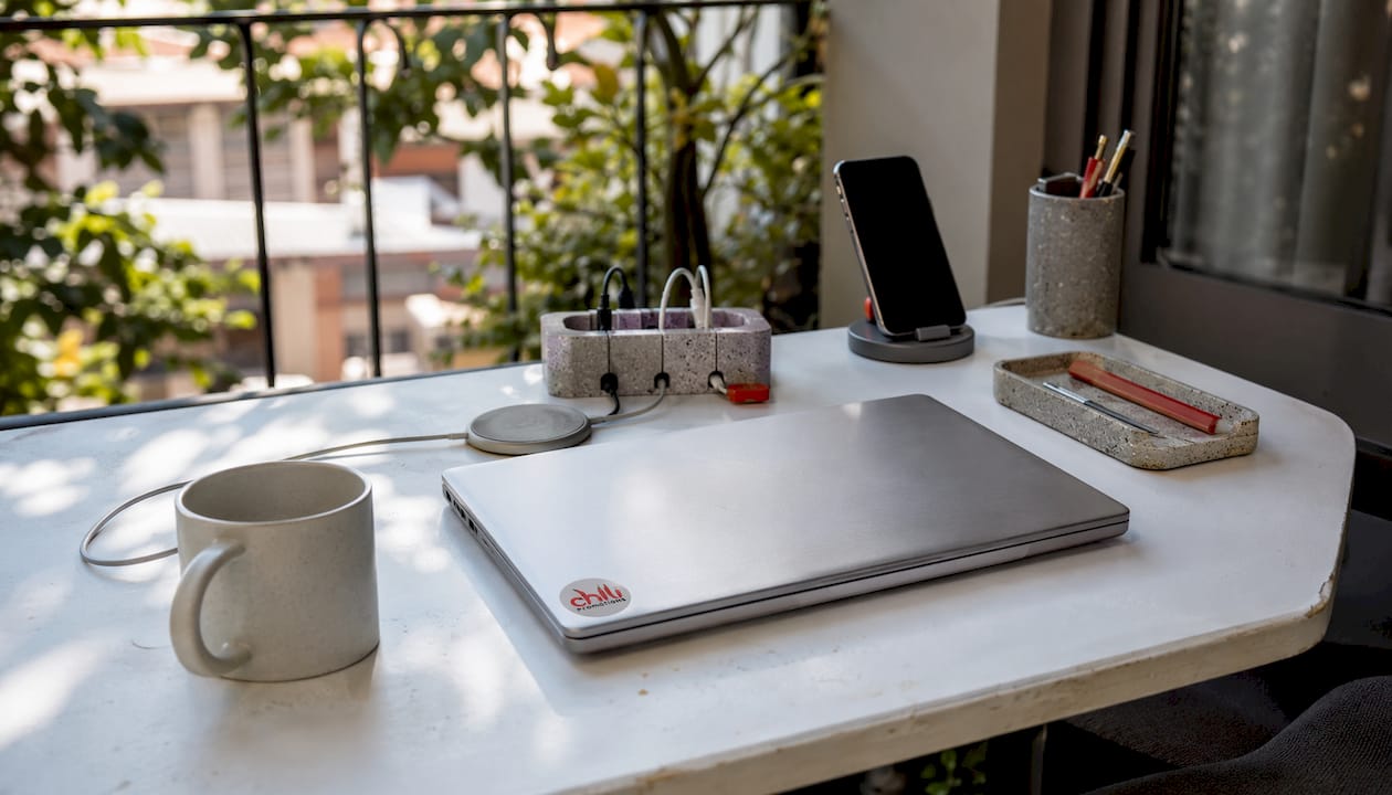Wireless charging pads and cable organisers on desk