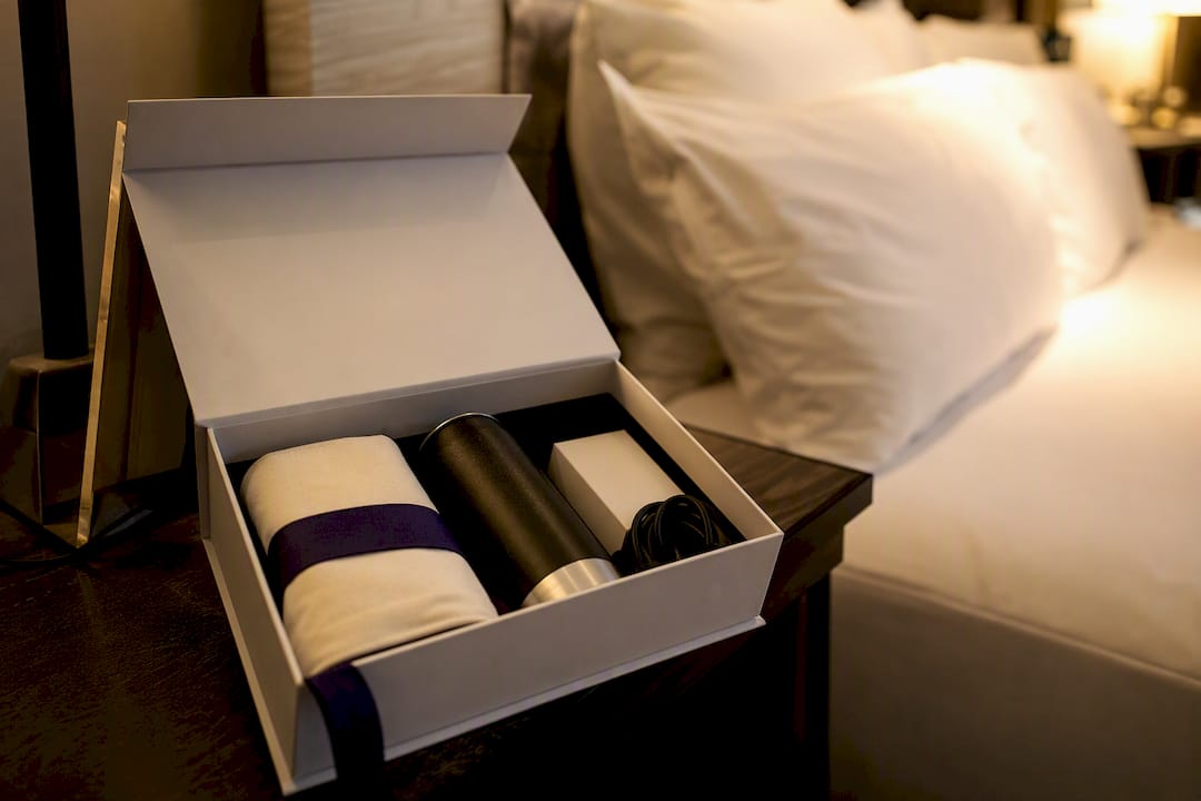 Branded welcome kit box on hotel desk