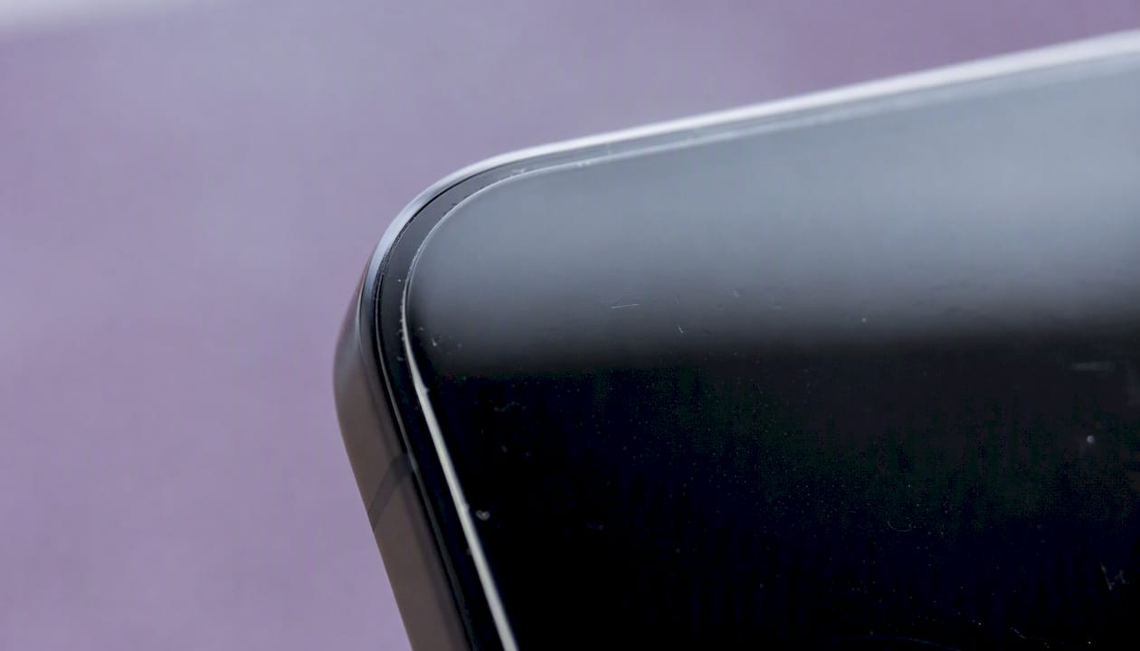 Close-up curved phone edge with ceramic film