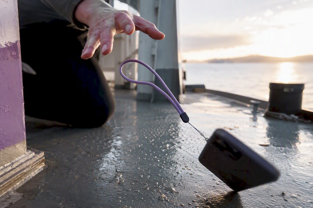 Wrist strap stopping phone fall on ferry deck