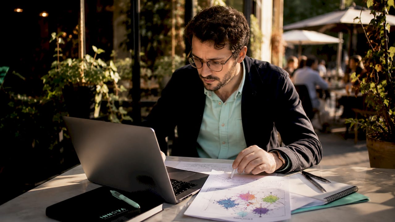 Scientist analyzing multi-omics data at workstation
