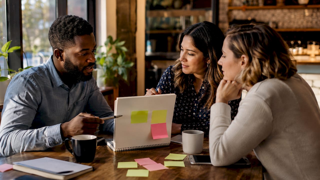 Team defining business question in meeting