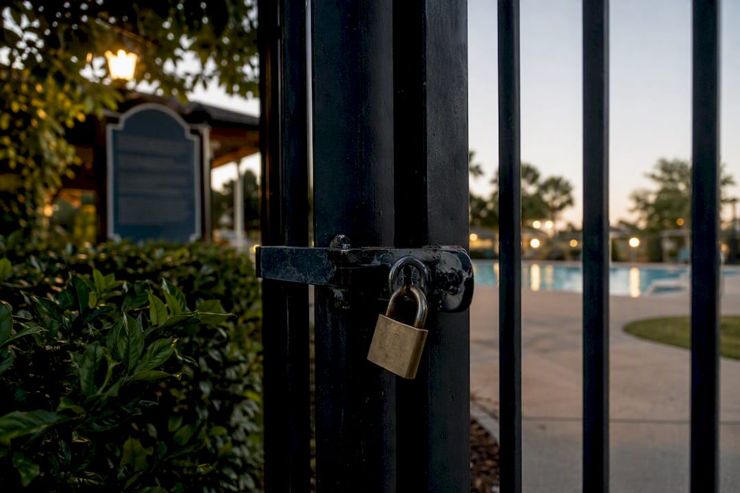 Locked padlock on community pool gate