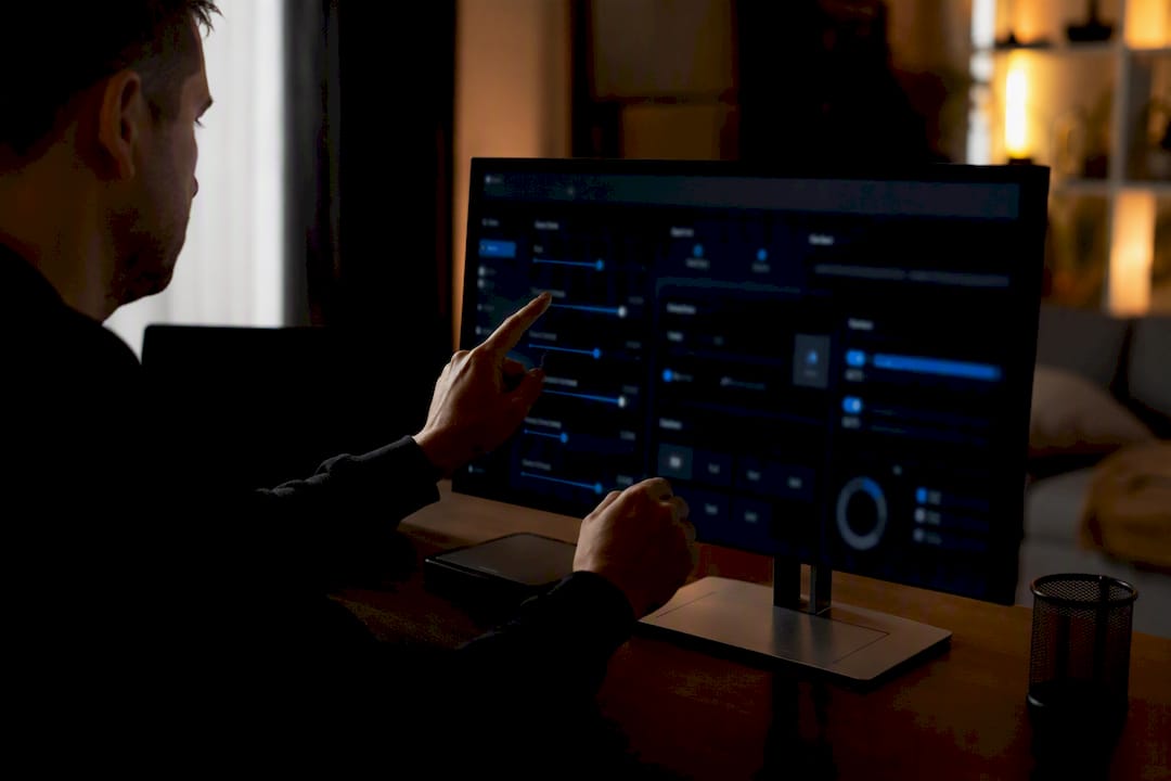 Hands adjusting automation controls