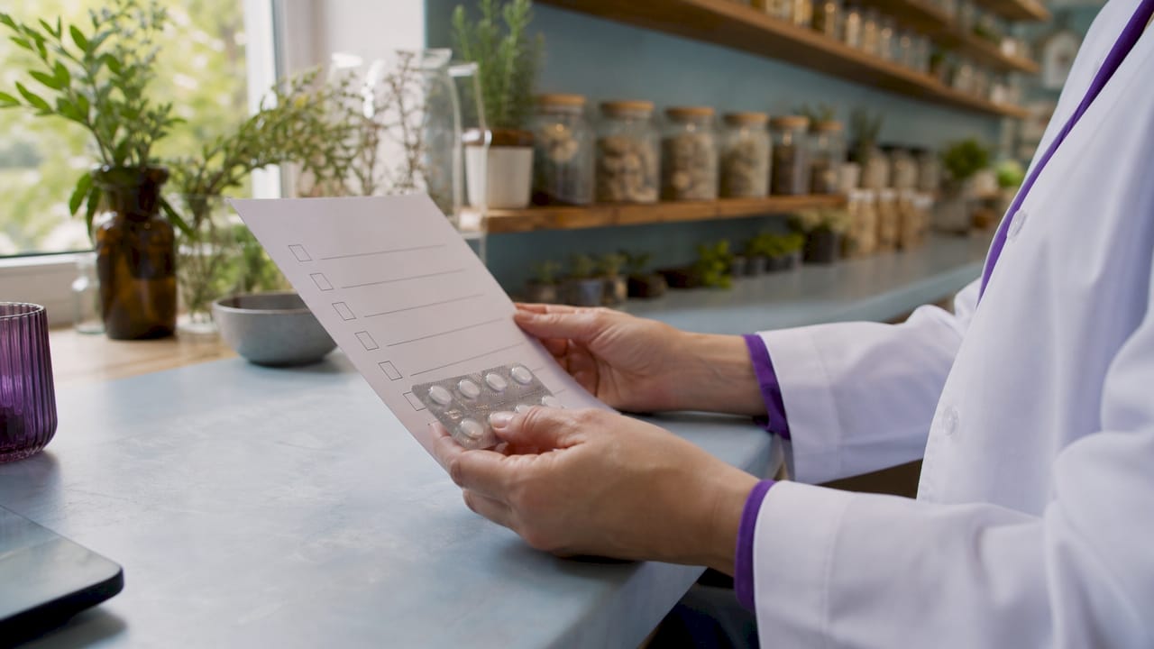 Pharmacist reviewing medication and HBOT safety checklist