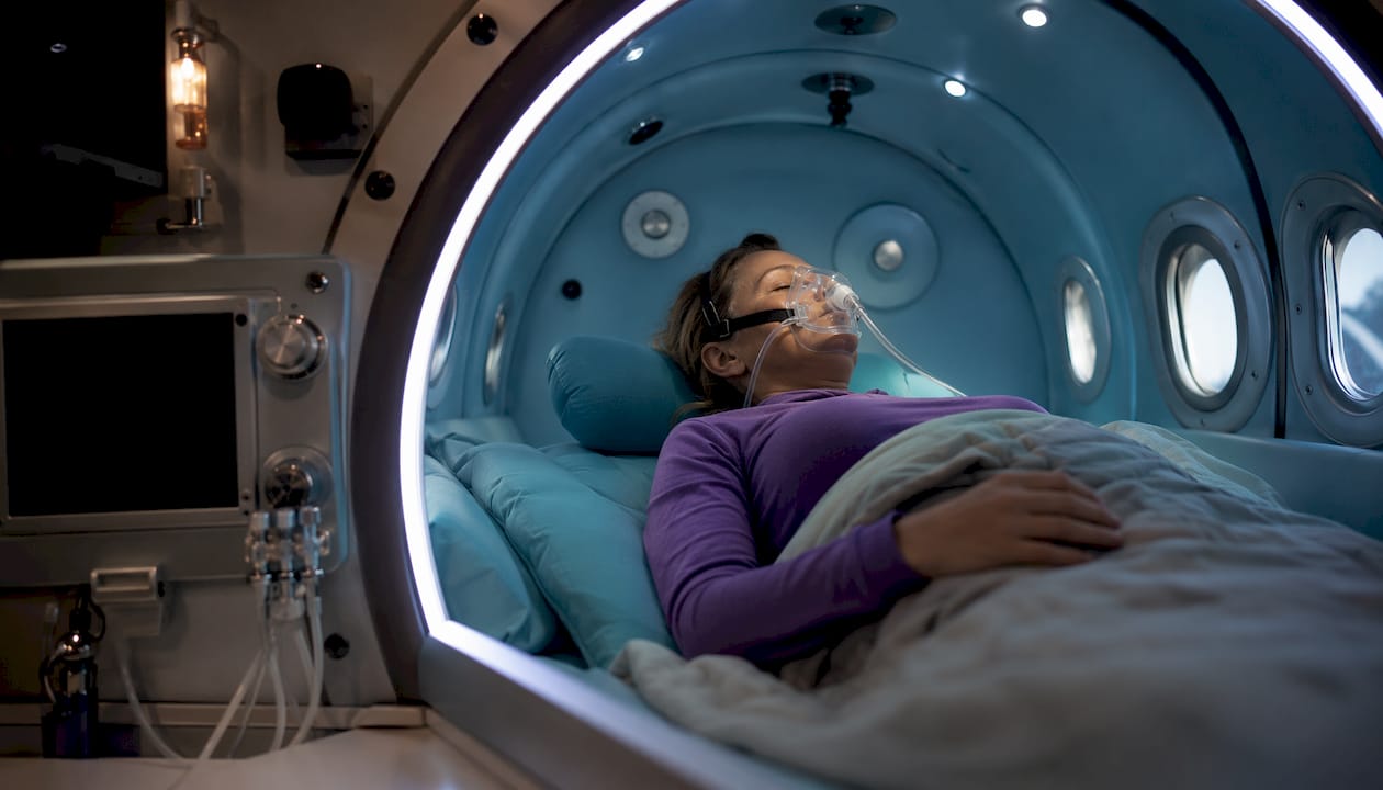Patient inside hyperbaric oxygen chamber