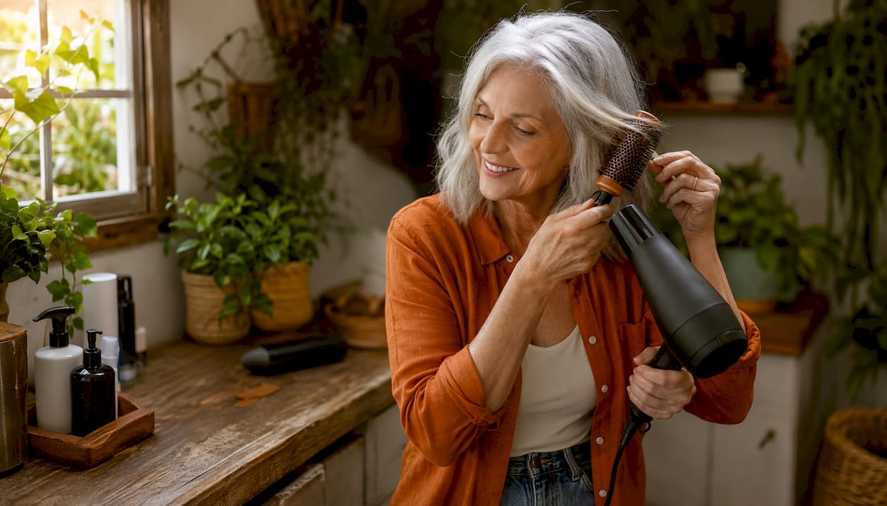 Woman styling vibrant silver hair