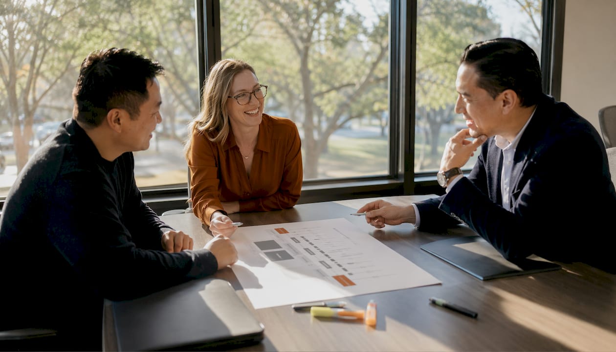 Professionals discussing commercial real estate funding stages