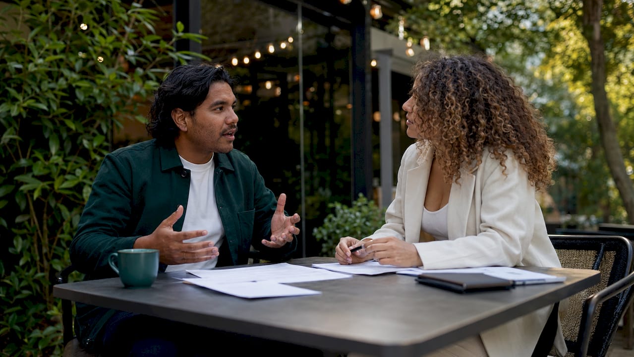 Buyers agent interviewing multiple candidates in office