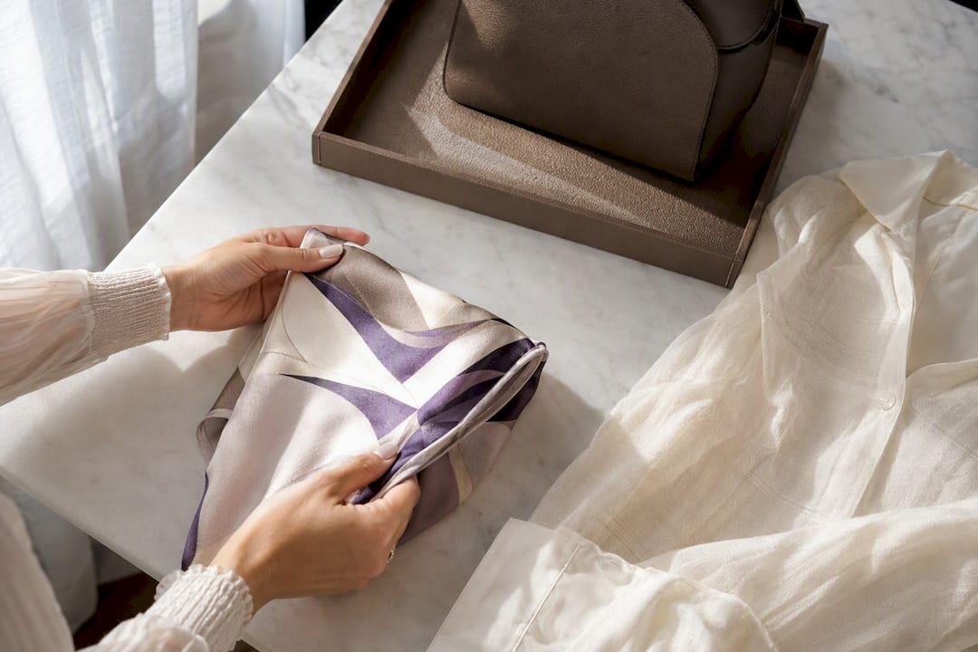 Silk scarf folded as a modesty layer