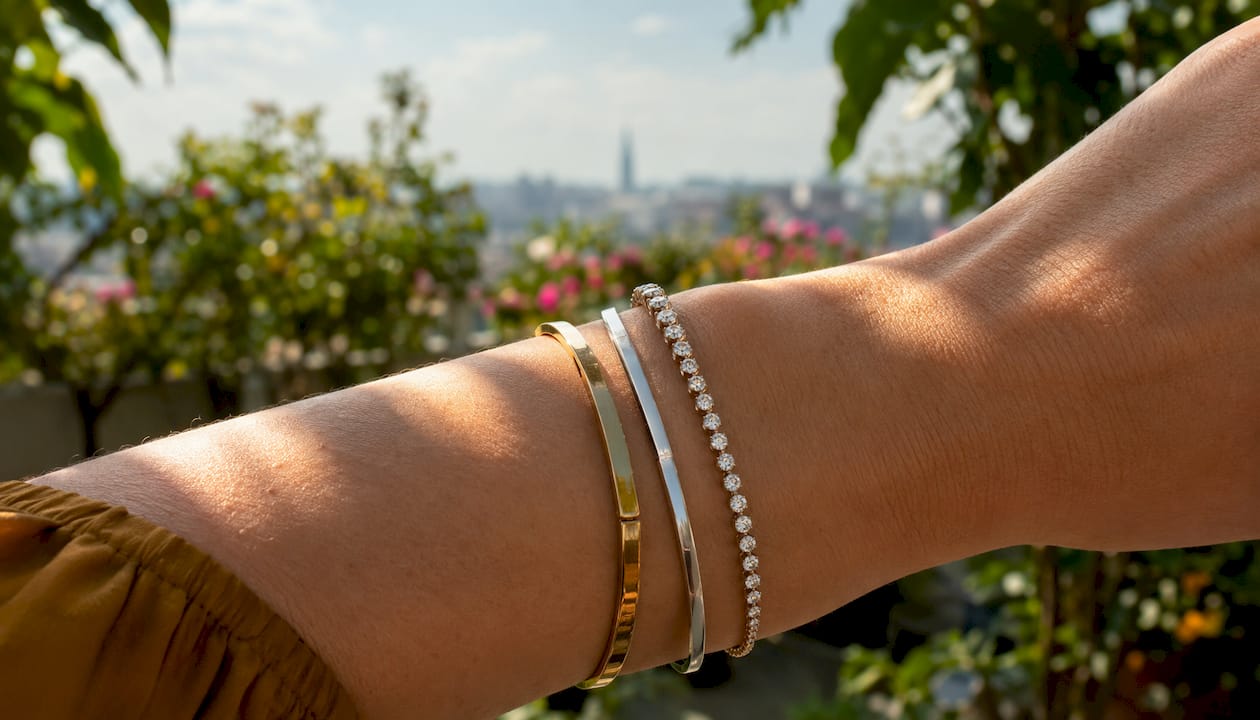 Close-up of wrist with layered luxury bracelets