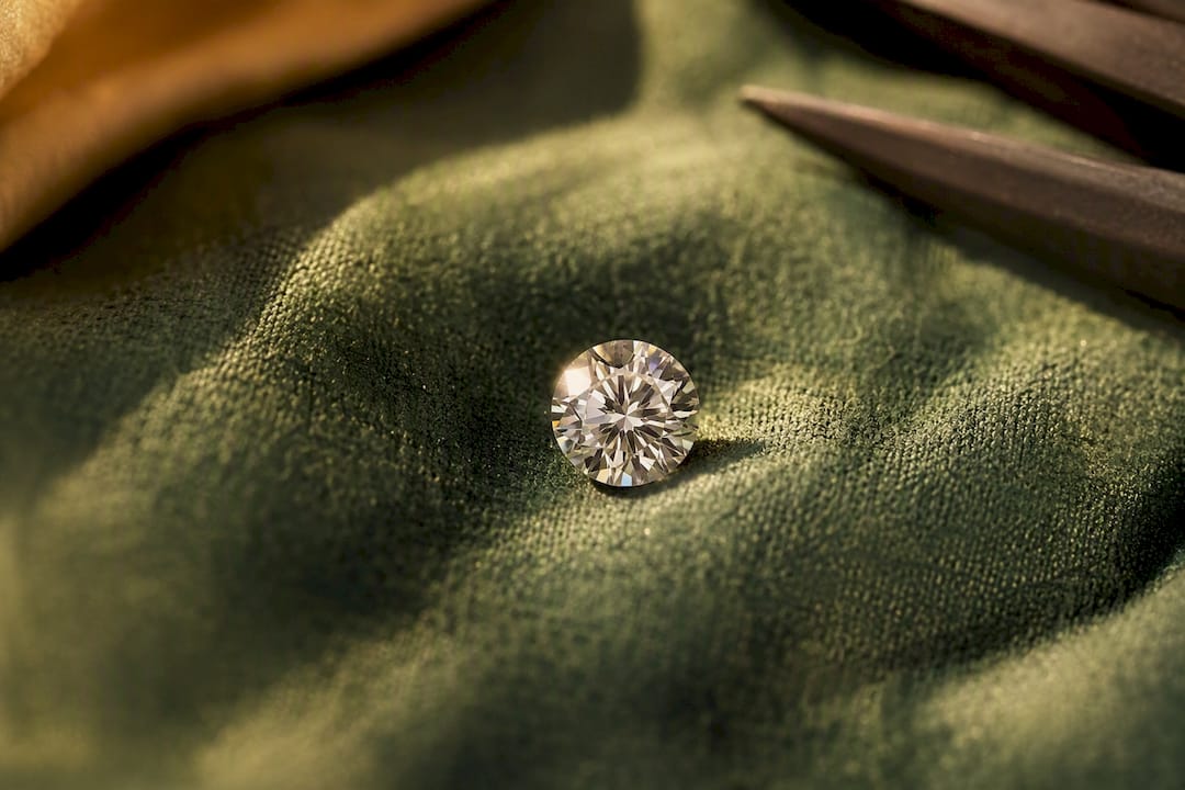 Brilliant cut diamond sparkling on fabric