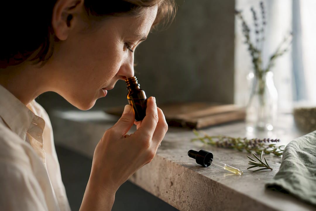 Evaluator examining essential oil scent
