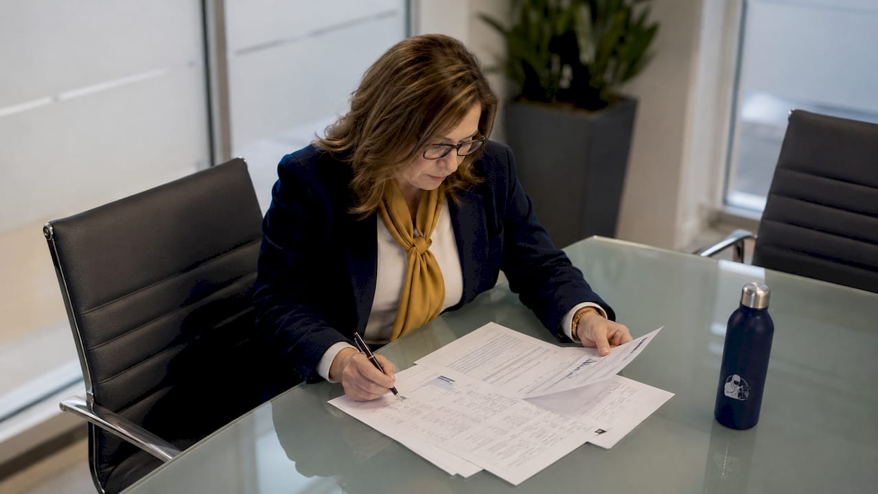 Compliance officer reviewing audit documents