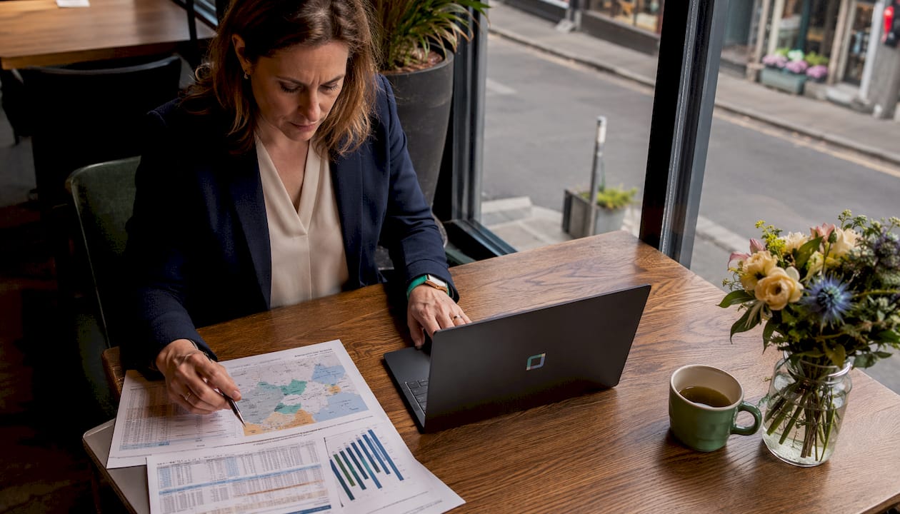 Insurance underwriter reviewing risk assessment data