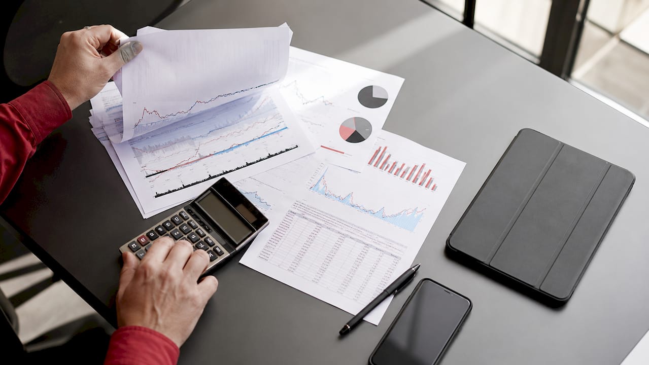 Diesel Price Fluctuation Impact on Operations: 2026 Guide 1 Analyst hands with diesel price market data papers