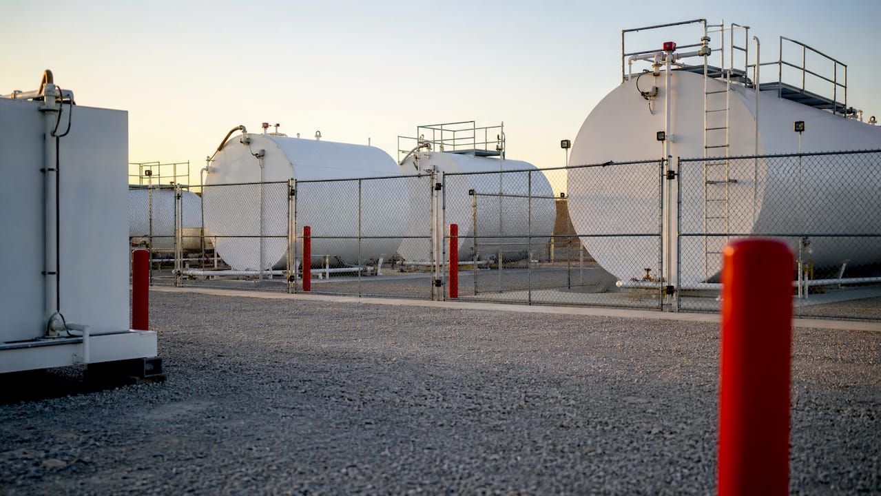 Fuel storage tanks secured in industrial yard