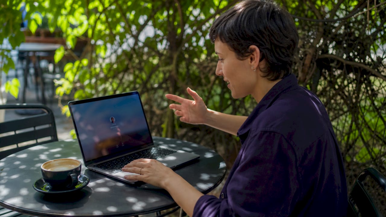 Couple coordinating unlocking MacBook Pro