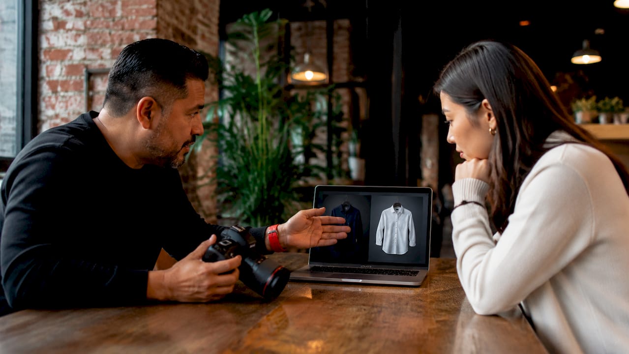 Photographer and client discussing wardrobe options