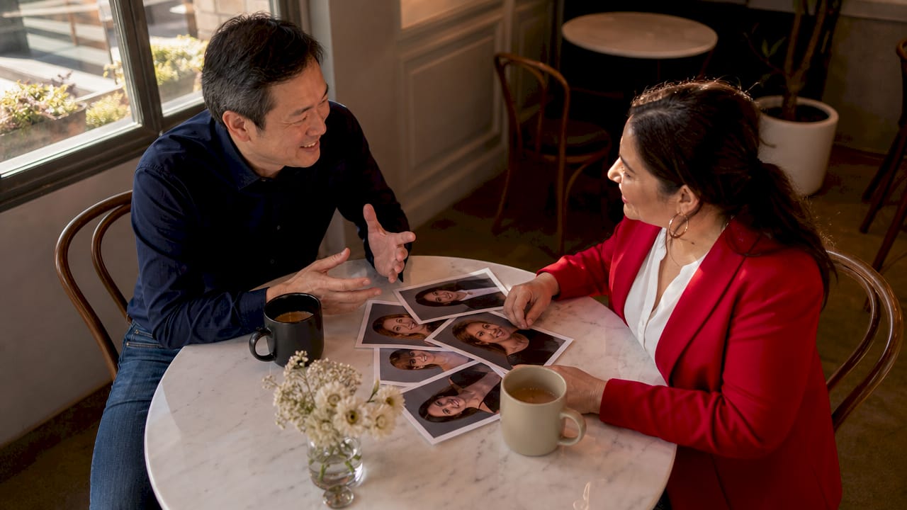 Photographer discussing headshot preferences with client