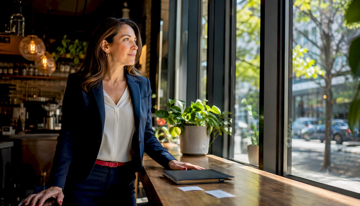 Female executive in modern office near window