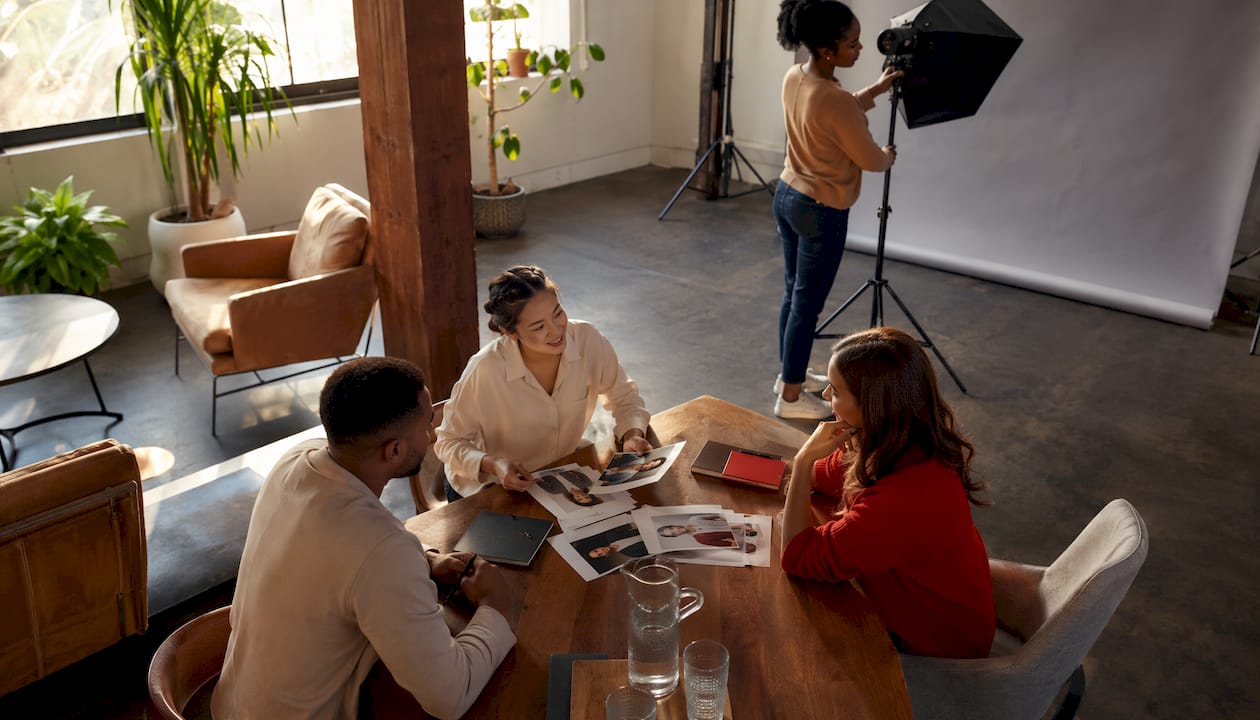 Corporate team preparing for professional headshot session