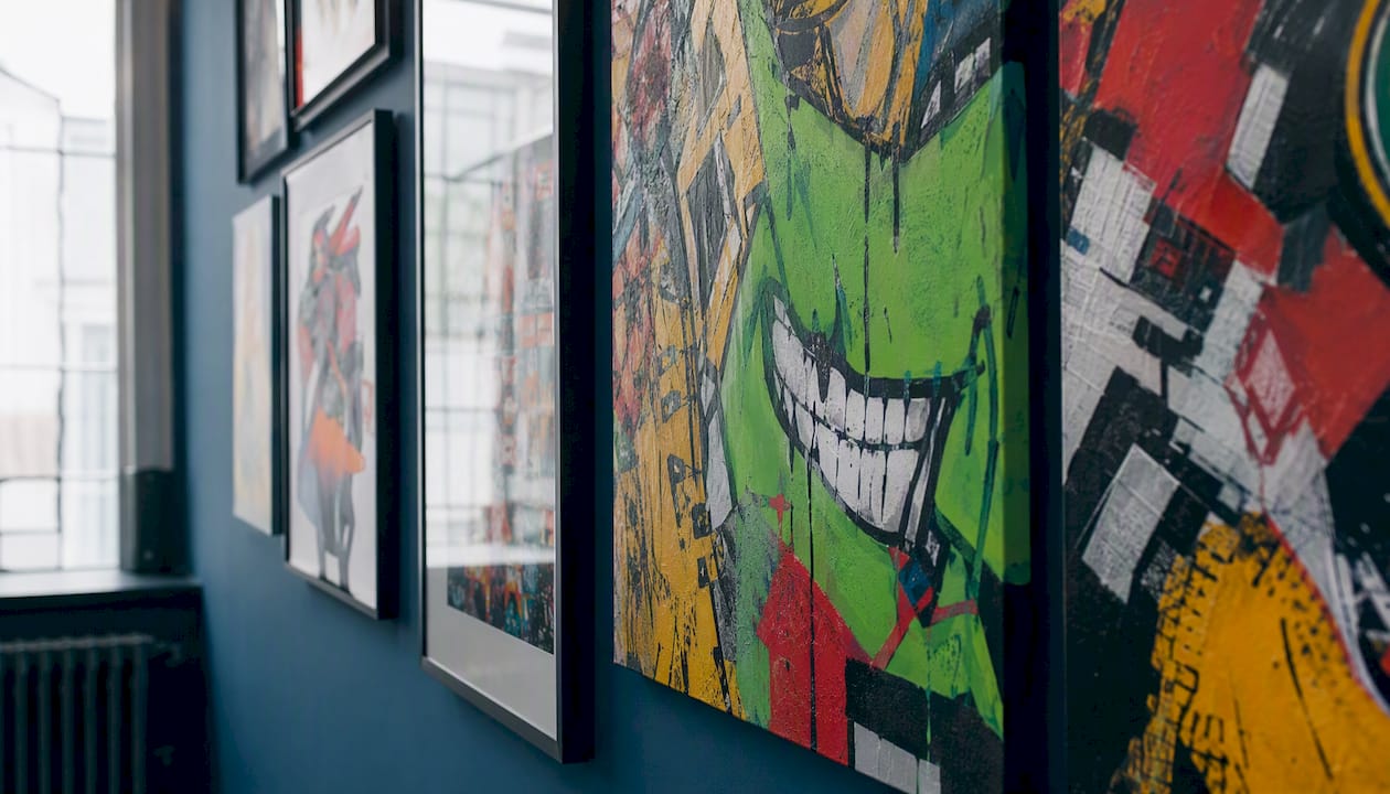 Mixed framed prints and gallery-wrap canvases on wall