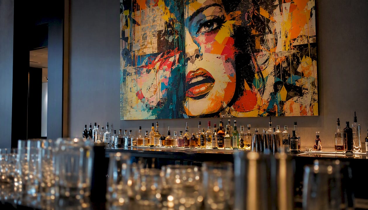 Bold artwork behind modern hotel bar