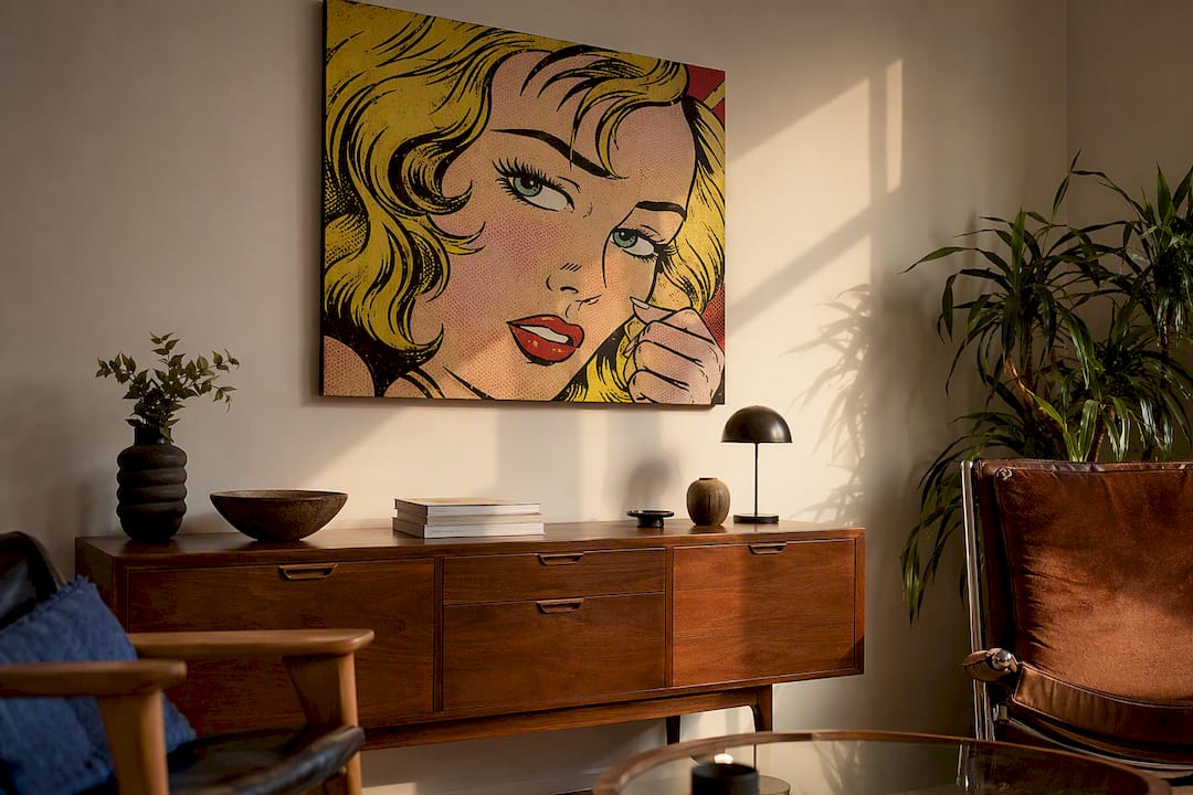 Living room with pop art canvas over thrift dresser
