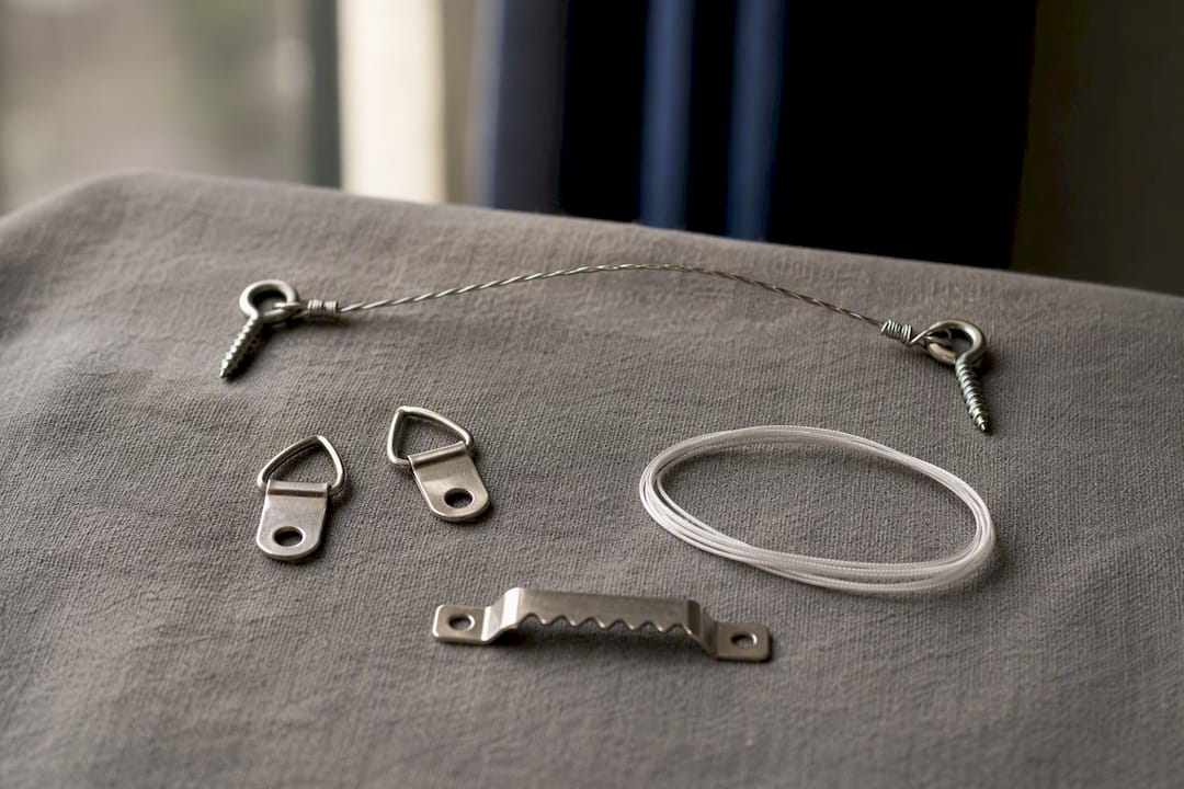 Three types of hanging hardware on wood