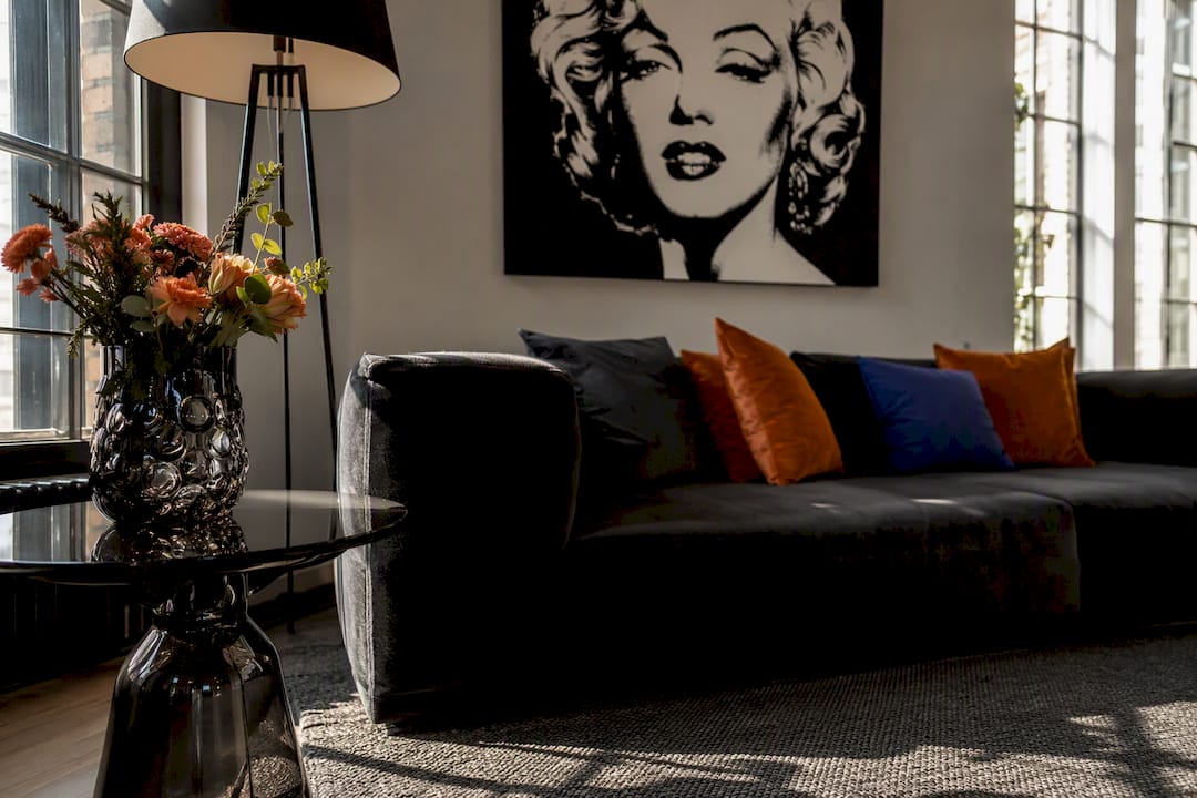 Mid-century room with coordinated Warhol-style art and accents