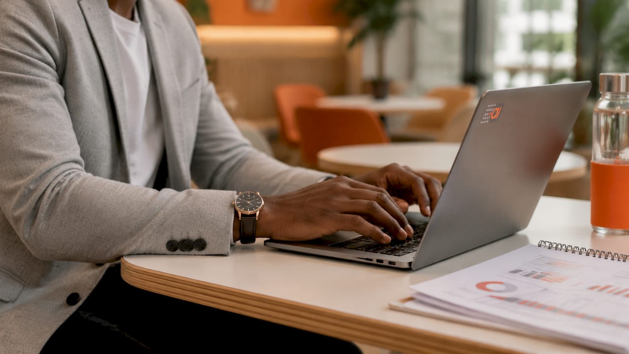 Hands typing on laptop for data decisions