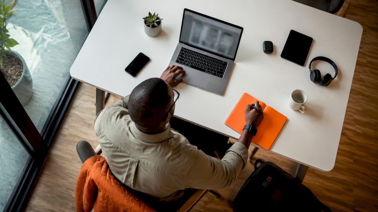 Consultant using drag-and-drop app builder laptop