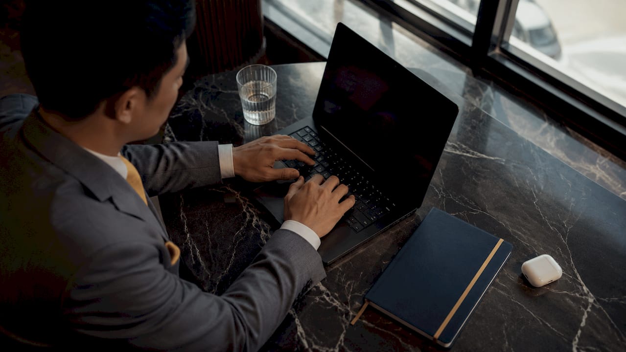 Hands typing LinkedIn thought leadership post