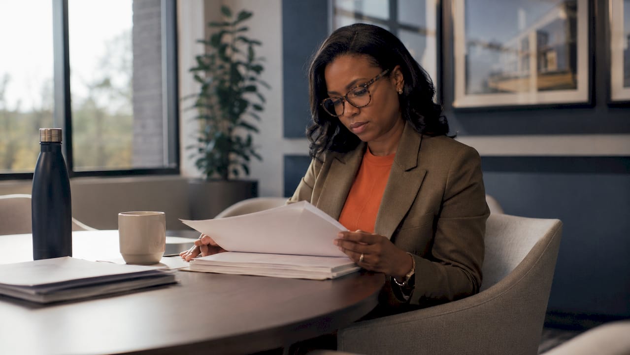 Woman reviewing federal contracting documents